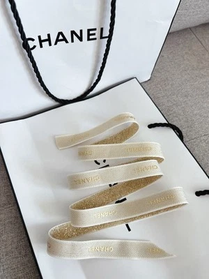 CHANEL Gold with white embossed lettering Ribbon Sold By Yard 100% Authentic - Image 1 of 4
