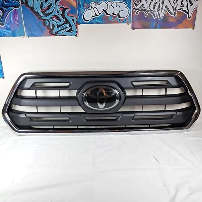 *DAMAGED* 2016-2020 Toyota Tacoma Front Upper Grille Chrome Surround Matte Black - Image 1 of 4
