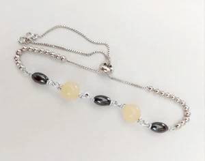 Bracciale cavigliera in acciaio e alluminio  con ematite e giada gialla da 8 mm - Imagen 1 de 7