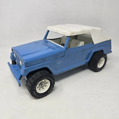 Jeepster Tonka vintage azul con techo blando blanco tracción en las 4 ruedas años 60 acero EE. UU. Foto 1 de 4