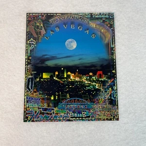 Las Vegas Postcard Treasure Island Hotel Casino Mirage Moonrise Cityscape - Picture 1 of 2