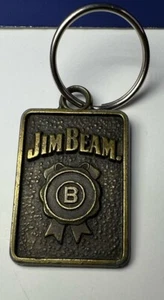 Llavero vintage Jim Beam whisky bronce metal 1" x 1,5" rectangular - Imagen 1 de 6
