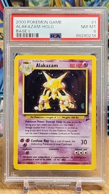 Pokémon TCG PSA 8 Alakazam 001/130 Base Set 2 Holo - Image 1 of 2