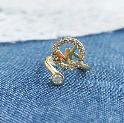 Anillo abierto Michael Kors con monograma y cristal dorado #7 Foto 1 de 3