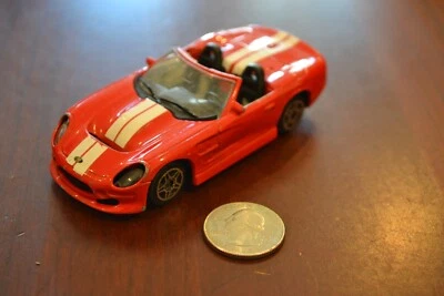 1:43 BBURAGO STREET FIRE SHELBY SERIE 1 ITALIA ROJO BLANCO RAYAS CARRO FUNDIDO A PRESIÓN Foto 1 de 4