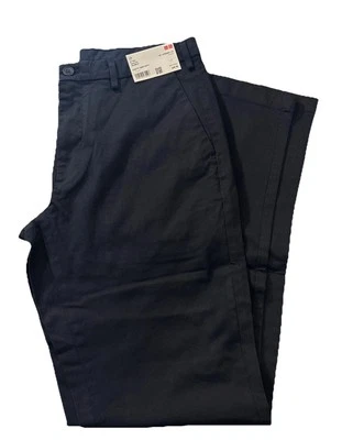 Pantalones chinos ajustados Uniqlo para hombre en azul marino elásticos 33x34 nuevos con etiquetas $50 Foto 1 de 4