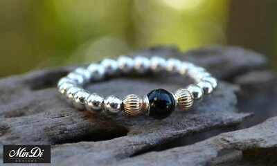 Anello elastico in oro 14 carati, onice nero e argento sterling. - Immagine 1 di 4