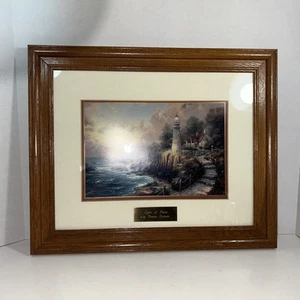 Framed Thomas Kinkade “The Light of Peace Print” Seaside Lighthouse & Cottage - Picture 1 of 19