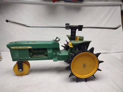 John Deere Traveling Lawn Sprinkler Tractor Die-cast Iron 4010  - Image 1 of 4