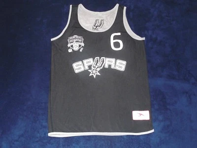 Camiseta deportiva reversible juvenil San Antonio Spurs Youth League Santikos Foundation L Foto 1 de 4