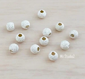 50 piezas mini espaciador de cuentas redondas sin costuras polvo de estrellas de 3 mm S13s - Imagen 1 de 2