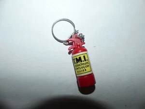 PORTE CLÉ PLASTIQUE EXTINCTEUR S ROUGE TMI MONTLUCON ALLIER - Imagen 1 de 1