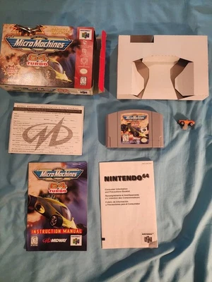 Nintendo N64 Completo Con Coche Y Raro Pieza Gris Micro Máquinas 64 Turbo Foto 1 de 4