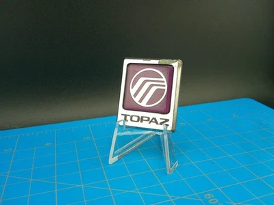 Capucha adorno topacio mercurio vintage emblema insignia logotipo OEM coche clásico pieza de automóvil Foto 1 de 4