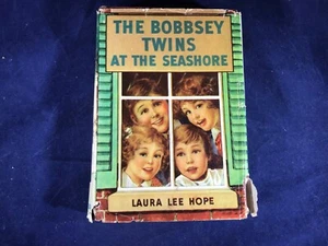 G-55 VINTAGE BOOK - THE BOBBSEY TWINS AT THE SEA SHORE - LAURA LEE HOPE - 1960 - Imagen 1 de 7
