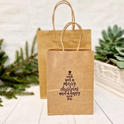 Bolsas de papel de Navidad con asas pequeñas medianas te deseamos feliz árbol de Navidad Foto 1 de 4