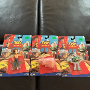 Toy Story Sammelfiguren Woody, Buzz und Hamm.  - Bild 1 von 7