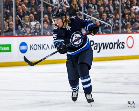 Patrik Laine Winnipeg Jets Unsigned Blue Jersey Shooting Photograph Cover