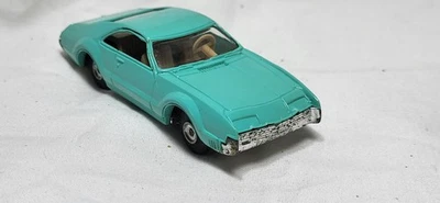 Caja de cigarros vintage AURORA Oldsmobile TORONADO verde original LIMPIA  Foto 1 de 4