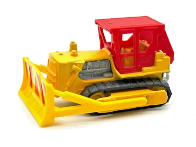 Bulldozer Matchbox MB64 1993 amarillo/rojo superior como nuevo en caja de exhibición de PVC Foto 1 de 4