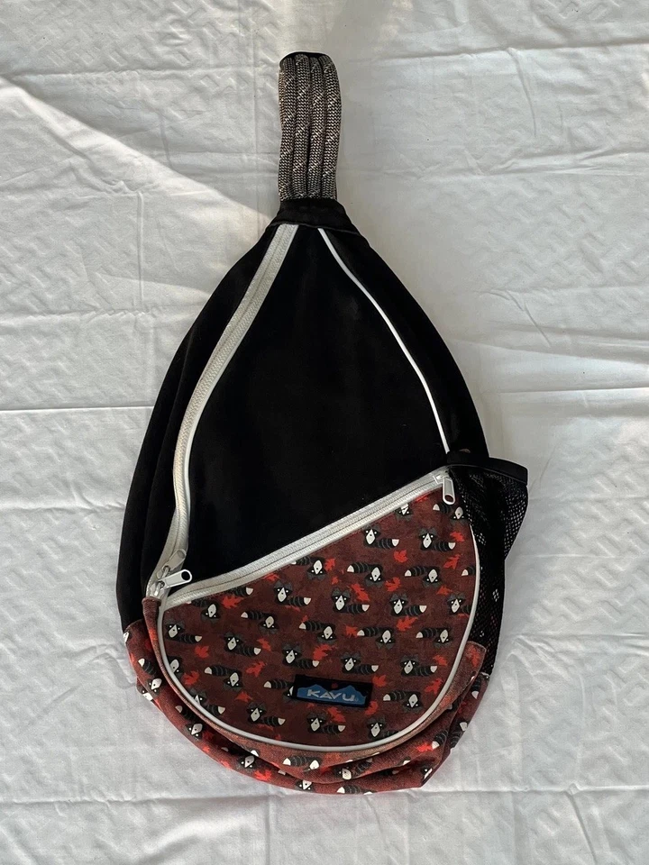 KAVU Rope Sling Bag Raccoon Print Black Red Crossbody Backpack Outdoors Hiking - Image 1 of 4