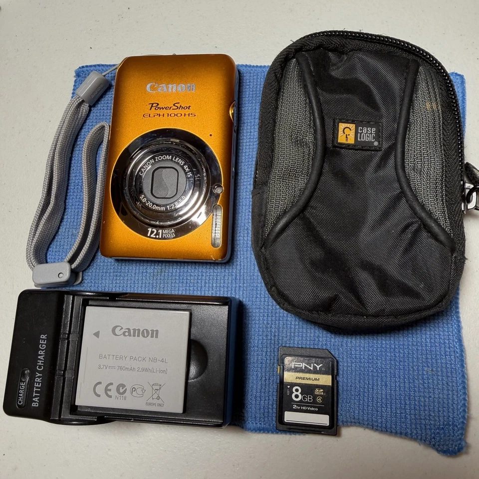 Cámara digital Canon PowerShot ELPH 100 HS 12 MP 4X zoom óptico naranja probado Foto 1 de 4