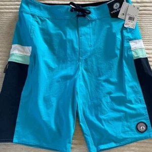 Volcom Boys Board Shorts Swim Suit Pockets Solid Blue size 30 Waist NEW - Picture 1 of 11
