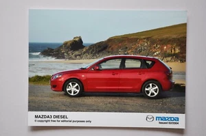 Foto de prensa de coche - Mazda 3 2004 diésel - rojo - vista lateral - Imagen 1 de 1
