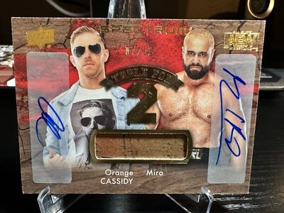 MIRO & ORANGE CASSIDY 2021 AEW UPPER DECK SPECTRUM TABLE FOR 2 RELIC DUAL AUTO - Image 1 of 2