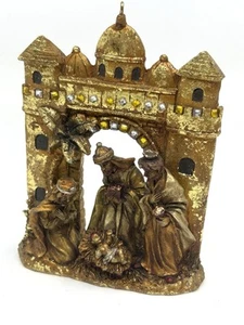 Nativity scene in castle Christmas gold ornament - Picture 1 of 5
