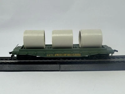 Tyco HO Scale Green Flat Car Western Maryland #2475 with Culvert Pipes - Image 1 of 4