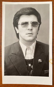 Photo portrait of a handsome boy in glasses gentle man, gay int Vintage photo