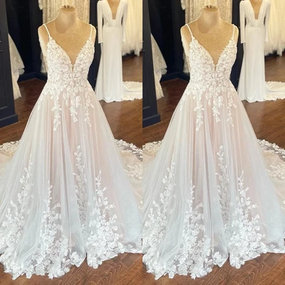 Apliques de encaje Vestidos de novia Correas de espagueti Cuello en V Profundo Vestidos de novia Línea A Foto 1 de 4