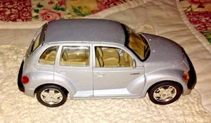 vtg 1/34 PULL BACK FRICTION SILVER PT CRUISER DOORS OPEN DIE CAST CAR CHRYSLER - Picture 1 of 6