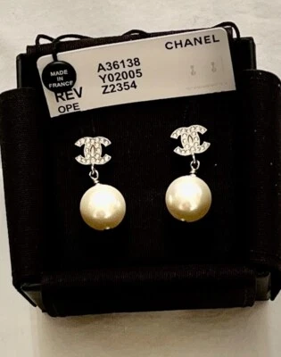 AUTH CHANEL REV CC LOGO SILVER & PEARLY WHITE PIERCED EARRINGS NWT - Image 1 of 4