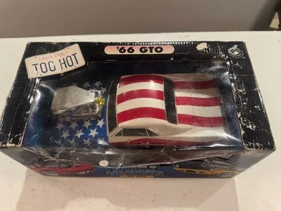 Muscle Machines 1966 Pontiac GTO Stars And Stripes 1:18 Scale Diecast Car  - Image 1 of 4