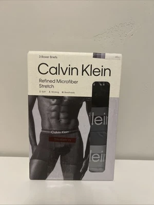 Paquete de 3 calzoncillos boxer elásticos de microfibra refinada Calvin Klein gris/negro para hombre L Foto 1 de 4