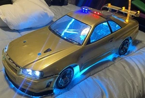 TRAXXAS 4tec 2.0 AWD W/ 12T Motor GOLD NISSAN GTR LED Lights POLICE RC Car - Picture 1 of 14