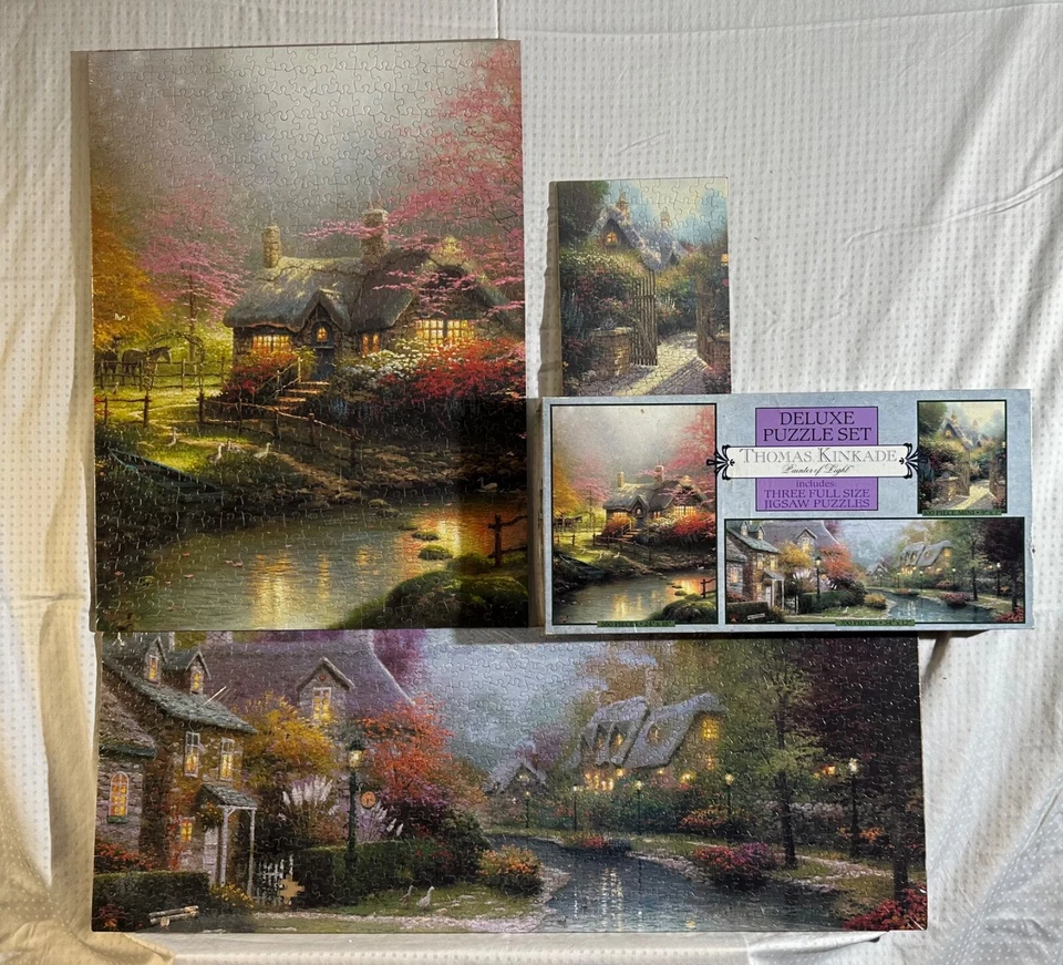 10 PUZZLES DIFERENTES - ROMPECABEZAS THOMAS KINKADE a través de 3 DIFERENTES 3 PAQUETES Y 1 SOLO Foto 1 de 4