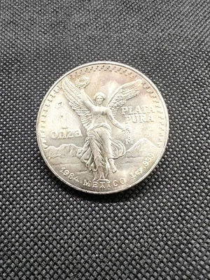 TONER🔥1984 Mexican Silver Libertad 1oz Mexico 1 ONZA Plata Pura Toning 999 Coin - Image 1 of 4