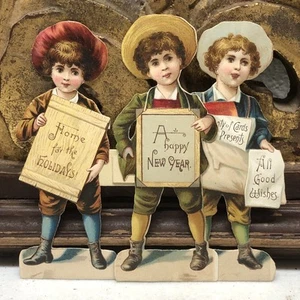 Raphael Tuch & Sons Troquelado Victoriano Niños con Letreros Hogar para las Fiestas ++ De Colección - Imagen 1 de 12