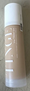 The TINGE Tint Body Makeup - Medium | Caldo - 3,38 fl oz / 100 ml - Foto 1 di 4