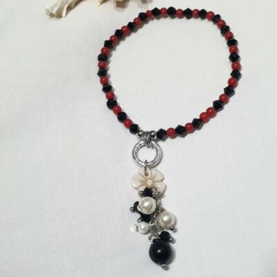 BRACCIALE CON CAMMEO IN PASTA DI CORALLO E ONICE , BRACCIALE ARGENTO CON FIORE - Immagine 1 di 3