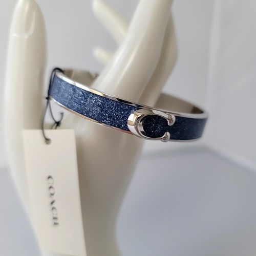 Bracciale Coach tono argento firma fibbia C cerniera a spinta in blu scintillante