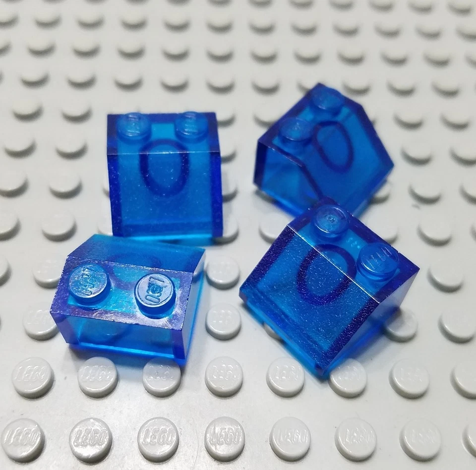 LEGO Lot of 4 Translucent Dark Blue 2x2 Slope Pieces - Image 1 of 1