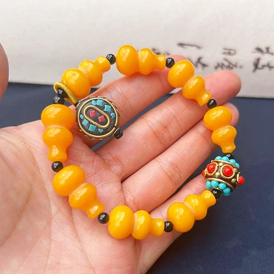 天然黄色琥珀葫芦手链手工琥珀蜂蜡珠手弦 — 第 1/4 张图片