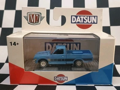 M2 Machines Auto Trucks R75 23-56 1977 Datsun Pickup Blue NIP 1:64 - Image 1 of 3