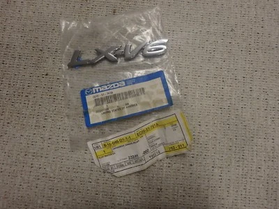 Новый оригинальный производитель Mazda Tribute 2001-2004 хромированная эмблема LX-V6 EC05-51-761A - Изображение 1 из 4