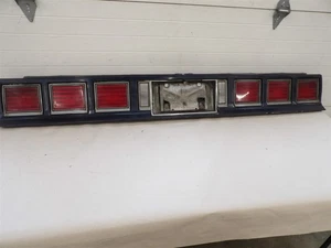 1980-1985 CHEVY IMPALA TAILLIGHT TAIL FINISHING PANEL WITH LICENSE GAS DOOR - Picture 1 of 11