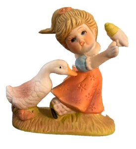 a… Niña con cono de helado con porcelana de ganso - Imagen 1 de 3